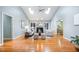 Bright living room featuring a vaulted ceiling, skylights, and a cozy fireplace at 313 Shetland Rd, Rougemont, NC 27572