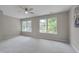 Bright, empty bedroom with two large windows, neutral paint, and plush carpeting at 314 Virens Dr, Cary, NC 27511