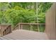Inviting outdoor deck space surrounded by lush greenery and natural light at 314 Virens Dr, Cary, NC 27511