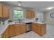 Kitchen view showcasing stainless steel appliances, wood cabinets, and ample counter space at 314 Virens Dr, Cary, NC 27511