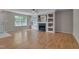 Bright living room featuring hardwood floors, a fireplace, and large windows offering plenty of natural light at 314 Virens Dr, Cary, NC 27511