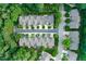 Aerial view of an upscale neighborhood featuring manicured lawns and tree-lined streets at 3619 Lion Ridge Ct, Raleigh, NC 27612