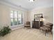 Bright bedroom with neutral walls, carpeted floors, and a large window providing natural light at 3619 Lion Ridge Ct, Raleigh, NC 27612
