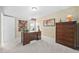 Bedroom with natural lighting featuring a desk and matching dresser at 3619 Lion Ridge Ct, Raleigh, NC 27612
