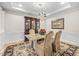 Formal dining room with an elegant table, china cabinet, chandelier, and tray ceiling at 3619 Lion Ridge Ct, Raleigh, NC 27612