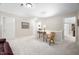 Inviting upstairs hallway showcasing a cozy reading chair with a table, neutral walls, and plenty of light at 3619 Lion Ridge Ct, Raleigh, NC 27612