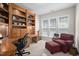 Bright office with custom built-ins, providing ample storage and workspace with natural light at 3619 Lion Ridge Ct, Raleigh, NC 27612
