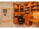 Functional office space showcasing custom built-ins, providing ample storage and workspace at 3619 Lion Ridge Ct, Raleigh, NC 27612
