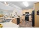 Kitchen with wood cabinets, tile flooring, a breakfast bar, and black appliances at 3619 Lion Ridge Ct, Raleigh, NC 27612