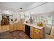 Kitchen with wood cabinetry, tile floors, black appliances and lots of natural light at 3619 Lion Ridge Ct, Raleigh, NC 27612