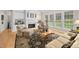 Comfortable living room featuring a fireplace, neutral palette, and lots of natural light at 3619 Lion Ridge Ct, Raleigh, NC 27612