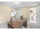 Bright home office features a large desk with an interesting statue lamp and view of the bathroom at 3619 Lion Ridge Ct, Raleigh, NC 27612