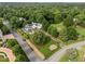 Aerial view of estate featuring expansive grounds with lush greenery and mature trees at 3816 Dover Rd, Durham, NC 27707