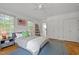 Spacious bedroom with hardwood floors, fan, and ample closet space at 3816 Dover Rd, Durham, NC 27707