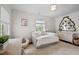 Cozy bedroom featuring a daybed, shag carpet, and decorative mirror above a dresser at 3816 Dover Rd, Durham, NC 27707