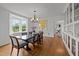 Formal dining room featuring a bay window, chandelier, and elegant decor, perfect for hosting dinner parties at 3816 Dover Rd, Durham, NC 27707