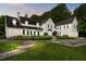 Elegant home featuring lush landscaping, stone pathway, and impeccable curb appeal at 3816 Dover Rd, Durham, NC 27707