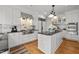 The gourmet kitchen boasts high-end appliances, granite countertops, a stylish backsplash, and ample storage solutions at 3816 Dover Rd, Durham, NC 27707