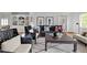 Cozy living room with stylish furniture, artwork, and a soft rug, perfect for relaxing and entertaining at 3816 Dover Rd, Durham, NC 27707