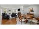 Open-concept living area featuring a fireplace, hardwood floors, and plenty of natural light, great for gatherings at 3816 Dover Rd, Durham, NC 27707