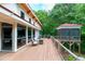 Expansive back deck with seating, grilling area, and views of the surrounding greenery at 382 Valley Ln, Pittsboro, NC 27312