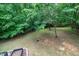 View of forested backyard with garden plot at 382 Valley Ln, Pittsboro, NC 27312