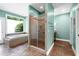 Bathroom showcases walk-in shower, soaking tub, and picture window with natural light at 382 Valley Ln, Pittsboro, NC 27312