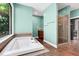Bathroom boasts a large soaking tub, walk-in shower, and stylish tile work at 382 Valley Ln, Pittsboro, NC 27312
