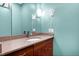Bathroom includes granite countertop vanity with double hair dryers and ample lighting at 382 Valley Ln, Pittsboro, NC 27312