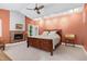 Cozy bedroom with fireplace and a comfortable bed, enhanced by warm lighting at 382 Valley Ln, Pittsboro, NC 27312