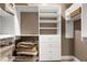 Closet featuring adjustable white shelving and drawers for optimal storage and organization at 382 Valley Ln, Pittsboro, NC 27312