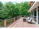 Scenic backyard deck featuring an outdoor fire pit and comfortable seating at 382 Valley Ln, Pittsboro, NC 27312