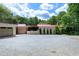Charming home exterior with a spacious driveway, multi-car garage and well-manicured landscaping at 382 Valley Ln, Pittsboro, NC 27312