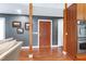 A decorative wooden front door leads to an open home with wood floors and stylish wall colors at 382 Valley Ln, Pittsboro, NC 27312