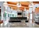 Contemporary kitchen features island with cooktop, stainless steel appliances, and open concept at 382 Valley Ln, Pittsboro, NC 27312