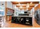 Modern kitchen with a large island, stainless appliances, and a seamless flow to the living room at 382 Valley Ln, Pittsboro, NC 27312