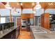 Contemporary kitchen design showcasing stainless steel appliances, granite countertops, and hardwood floors at 382 Valley Ln, Pittsboro, NC 27312