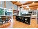 Gourmet kitchen with a large island, dining area, and easy access to living area at 382 Valley Ln, Pittsboro, NC 27312