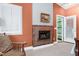 Bedroom with beautiful fireplace, window with shutters and access to the outside at 382 Valley Ln, Pittsboro, NC 27312