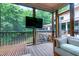 Relaxing screened porch with comfortable seating and views of surrounding greenery at 382 Valley Ln, Pittsboro, NC 27312