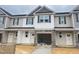 Charming townhouse showcases stone accents and a modern color palette, complete with a convenient attached garage at 3920 Well Fleet Dr, Fuquay Varina, NC 27526
