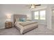Serene main bedroom features a comfortable bed, soft lighting, and ample natural light, creating a relaxing retreat at 3924 Well Fleet Dr, Fuquay Varina, NC 27526