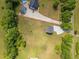 Birds-eye view of property including home, garage, and boat storage at 412 Carr Store Rd, Cedar Grove, NC 27231