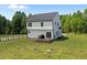 Expansive backyard featuring lush lawn, two-story home, and room for gardening and outdoor fun at 412 Carr Store Rd, Cedar Grove, NC 27231