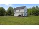 A well-maintained two-story home boasting a spacious backyard, perfect for outdoor activities at 412 Carr Store Rd, Cedar Grove, NC 27231