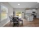 Bright dining area with a view of the backyard, connected to kitchen, and room for seating at 412 Carr Store Rd, Cedar Grove, NC 27231