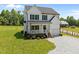 Charming two-story home with a welcoming front porch, gravel drive, and well manicured lawn at 412 Carr Store Rd, Cedar Grove, NC 27231