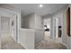 Second story hallway with neutral paint palette and carpet leads to bedrooms and bathroom at 412 Carr Store Rd, Cedar Grove, NC 27231
