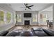 Inviting living room with a fireplace, hardwood flooring, and lots of natural light at 412 Carr Store Rd, Cedar Grove, NC 27231