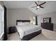 This primary bedroom features vaulted ceilings, ceiling fan, and abundant natural light at 412 Carr Store Rd, Cedar Grove, NC 27231